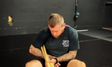 This is why you tap immediately. A BJJ practitioner demonstrating the breaking mechanics of an ankle lock on 3 baseball bats