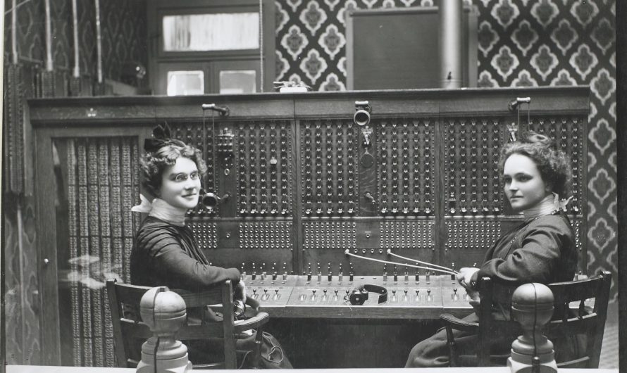 2 women working at the Telephone switchboard of Junction city, Kansas, 1900. Glass negative