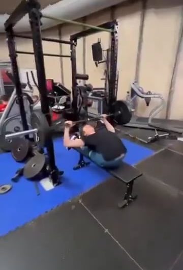 A Cirque du Soleil acrobat lifts 50kg while his body is folded in half.