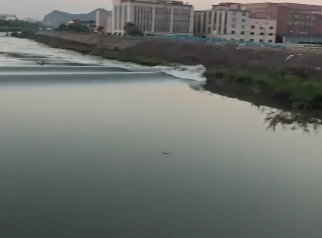 A lone kayaker riding the tide