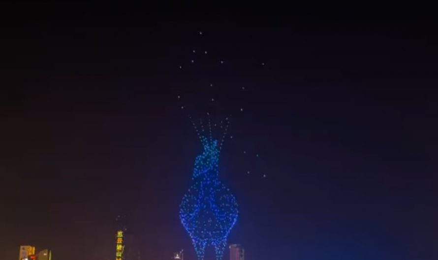 A stunning drone animation blending a peacock and a dancer in the Chongqing night sky