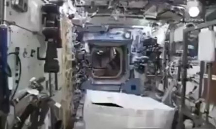 Astronaut Mark Kelly putting on a gorilla suit he smuggled into the ISS to prank his crewmates