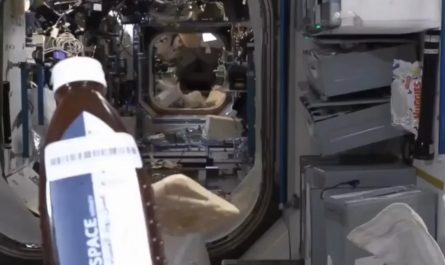 Astronaut eating bread and honey in space