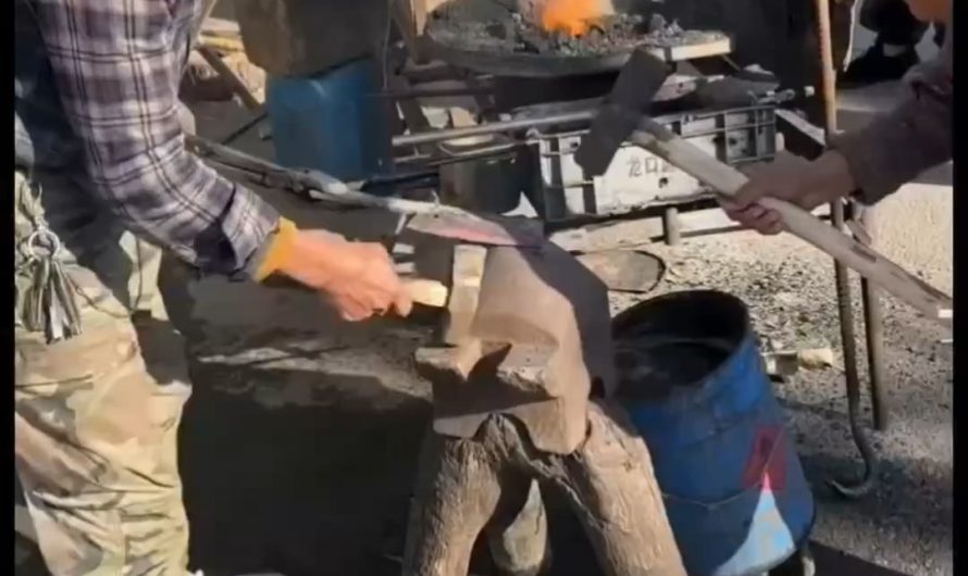 Blacksmiths working in tandem