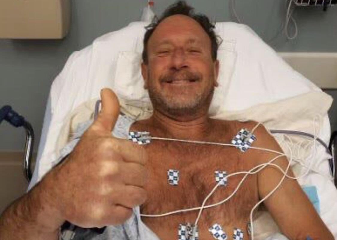 Cape Cod lobster diver flashes a thumbs up from his hospital bed after surviving being swallowed and spit out by a humpback whale.