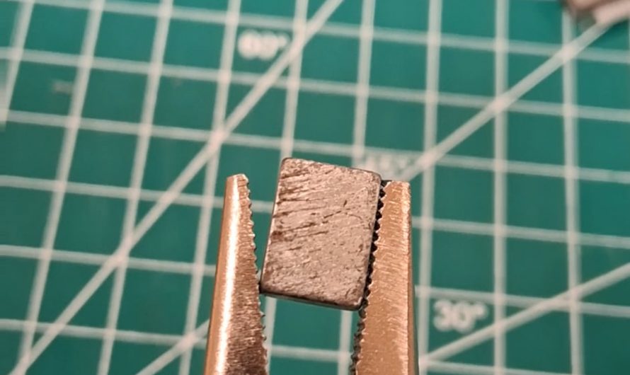 Clicking noise make from pliers and a magnet.