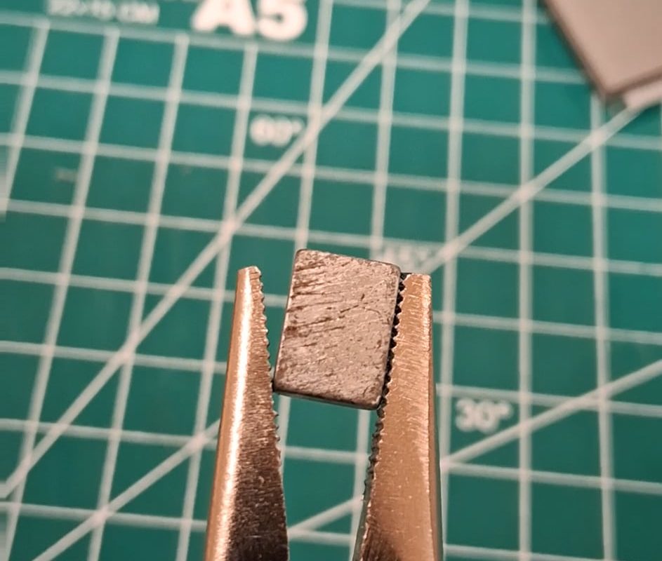 Clicking noise make from pliers and a magnet.