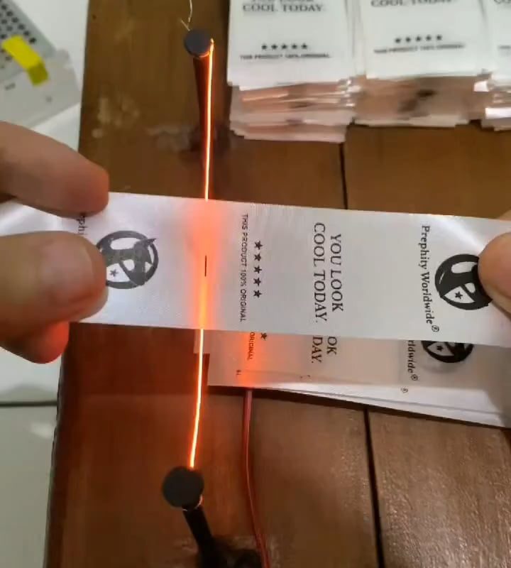 Cutting labels using only heated wire