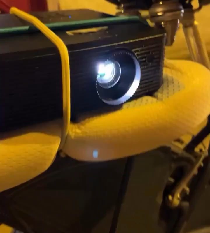 Dude puts a projector in his bike and projects a horse sidekick