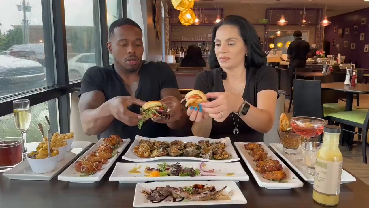 Food influencers were hit by a car while reviewing a burger inside a restaurant.