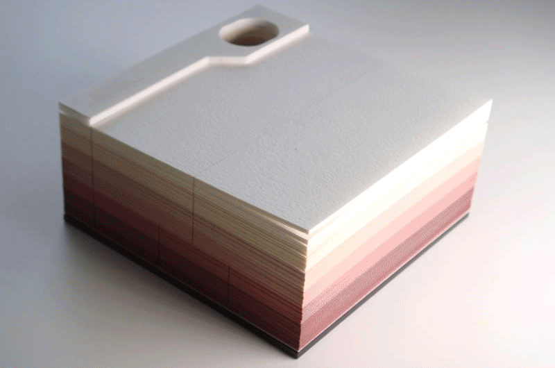 Laser-cut paper notecards: As you use them, a hidden object is excavated