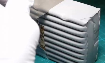 Making a clay figure of a Coke can