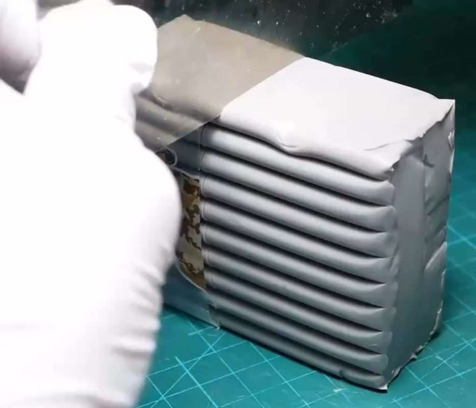 Making a clay figure of a Coke can