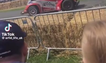 Man casually hops out of a drifting car to greet people