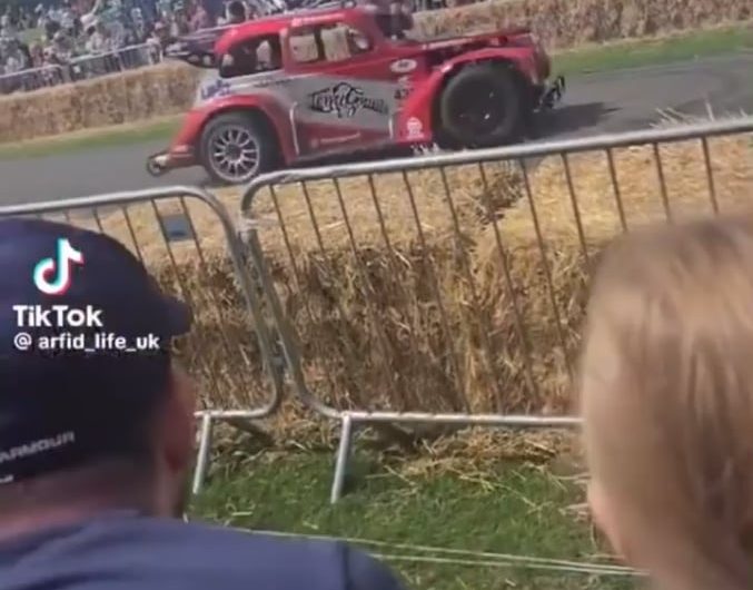 Man casually hops out of a drifting car to greet people