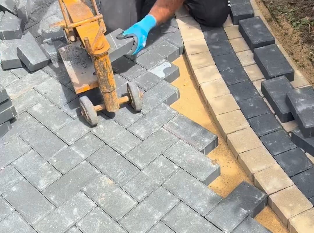 Man cuts and places blocks precisely around a circle