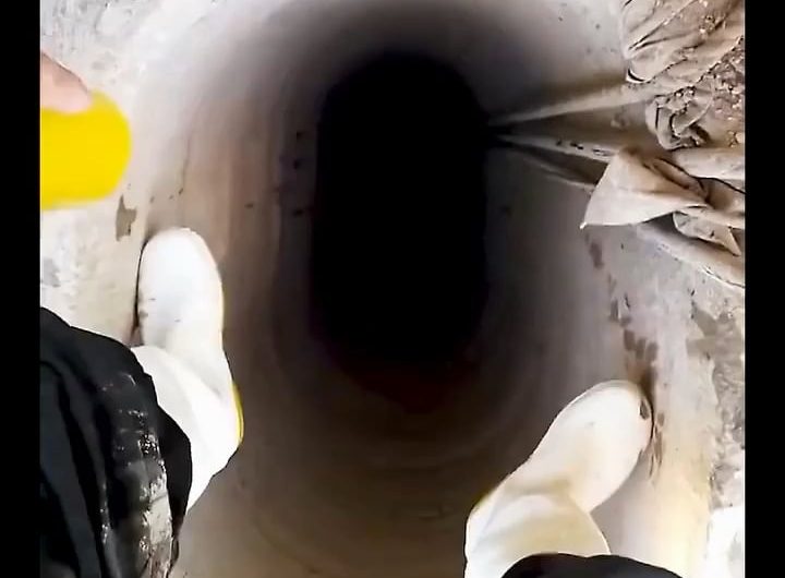 Man goes deep into the well to repair it.