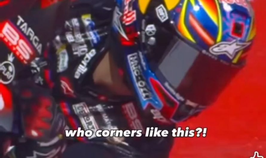 MotoGP rider leaning Into a turn