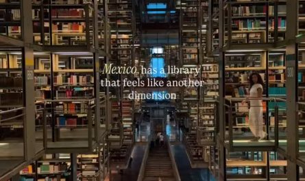 Multi-level interior of Biblioteca Vasconcelos in Mexico showing suspended book shelves, skybridge walkways, and open atrium layout.