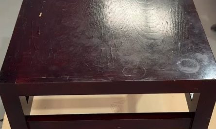 Paint stripping an old wooden table