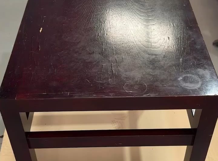 Paint stripping an old wooden table
