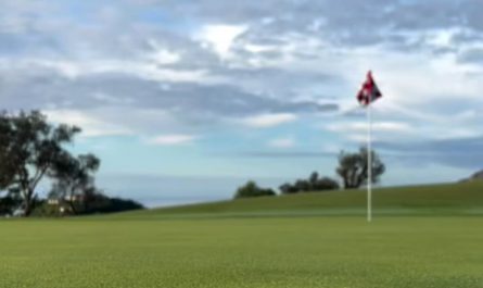 Planting flagstick in a golf course