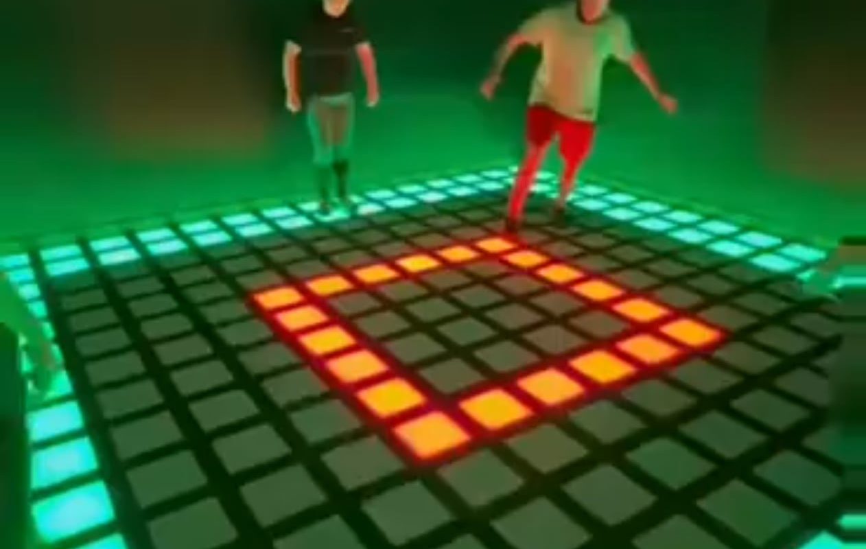 Players work together in lighted floor game