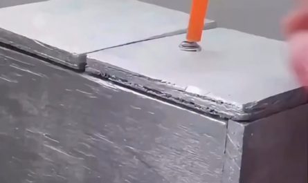 Push the orange thing. Wait for box to open and push it back. Rinse and repeat.