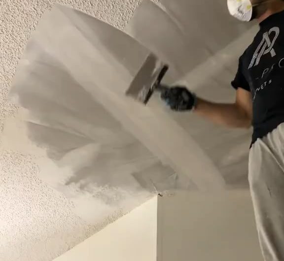 Removing that terrible popcorn ceiling at last. Lovely on many levels