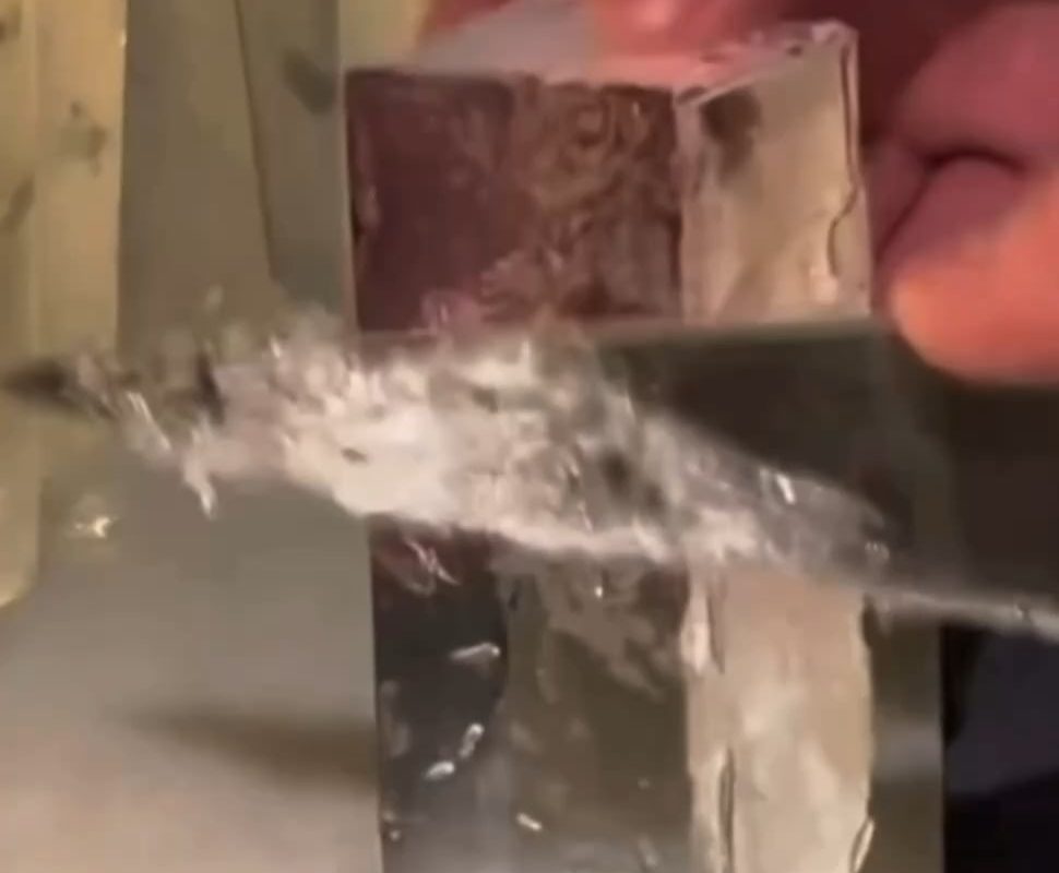 Shaving the frost off a small ice block