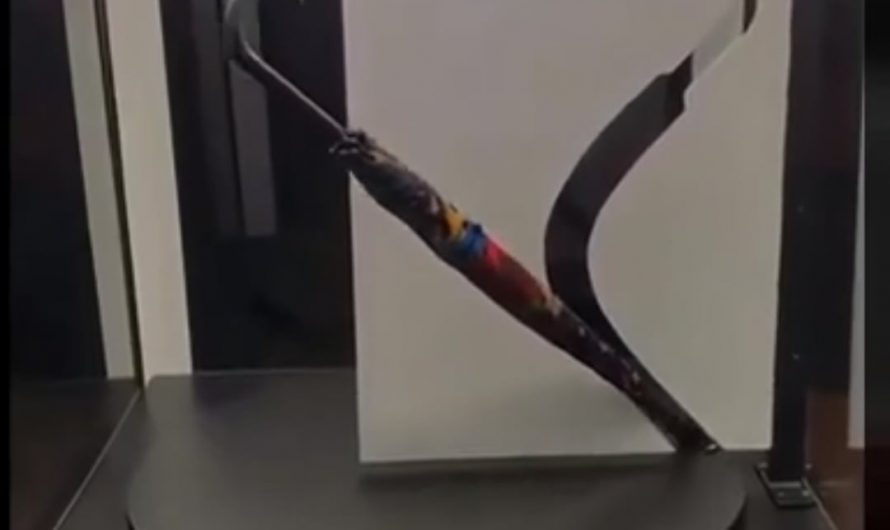 Straight umbrella passes through a curved opening.