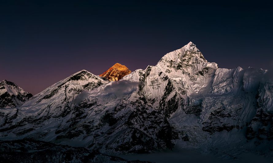 Sun setting over Everest with Nuptse in the foreground. Despite being almost 1000m (3300 ft.) shorter than Everest, Nuptse is a much more challenging mountain. Fewer than 40 people have successfully summited this 7861m / 25791ft peak since its first ascent on May 29 1961. [photo by me]