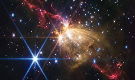 The James Webb Space Telescope captured a stunning image of a massive stellar jet from a newborn star in the nebula Sharpless 2-284. The jet, resembling a double-bladed lightsaber, spans over 8 light-years and comes from a young star about ten times the mass of our Sun.