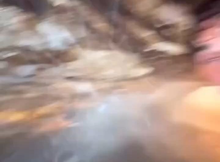 The waterfall in Venezuela’s Canaima National Park glows like lava at sunset because mineral-rich water and low-angle sunlight scatter red light through the mist