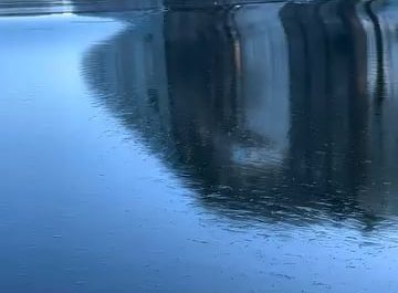 Thin sheet of ice in a wave pool