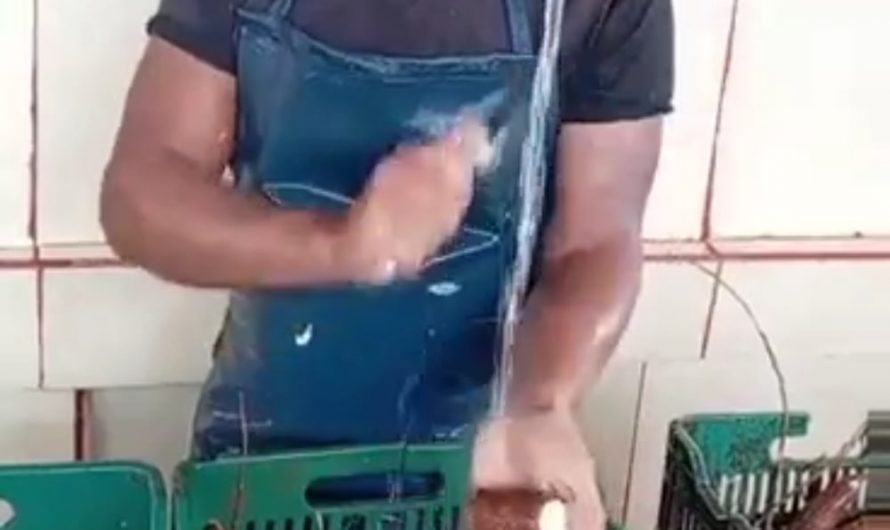 This man peeling cassava.
