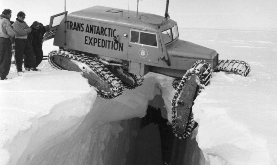 Tucker Sno-Cat hanging over a deep Antarctic crevasse during the Trans-Antarctic Expedition