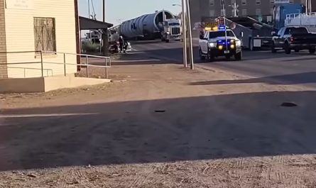 Video shows train derailing after crashing into tractor-trailer.