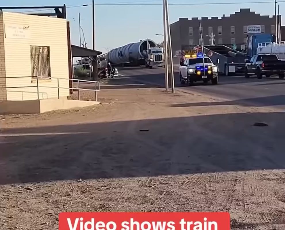 Video shows train derailing after crashing into tractor-trailer.