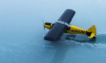 Wheel-ski takeoff from an icy lake in Alaska