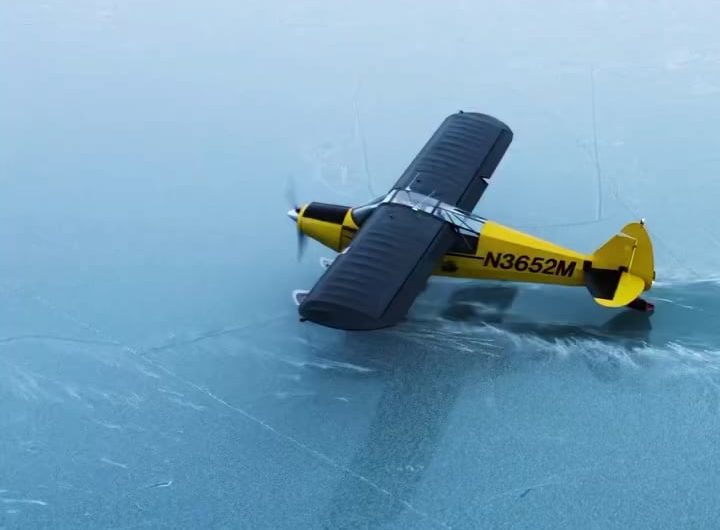 Wheel-ski takeoff from an icy lake in Alaska