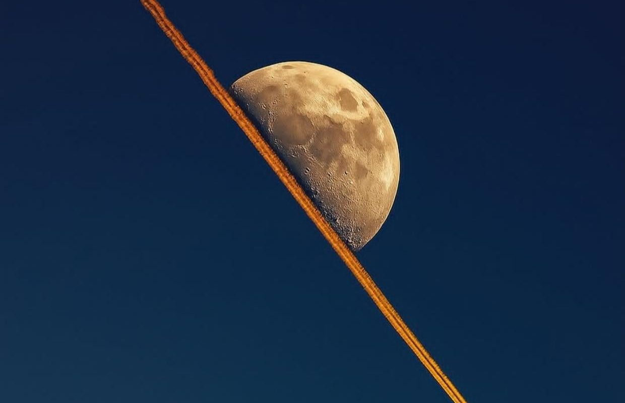 When a jet's contrail lined up perfectly with the moon.
