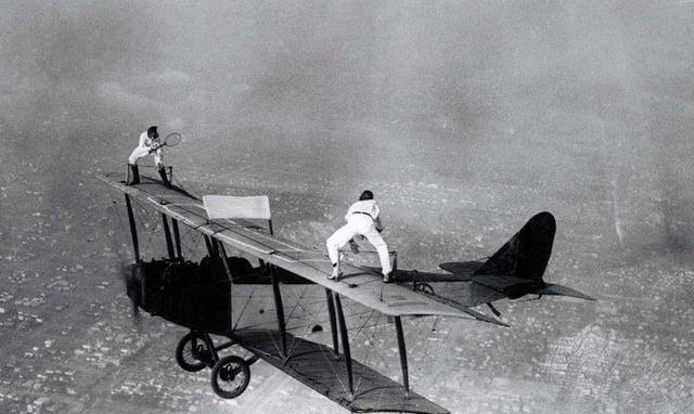 1925 pic of a Promotional Tennis Match atop the wing of a Plane