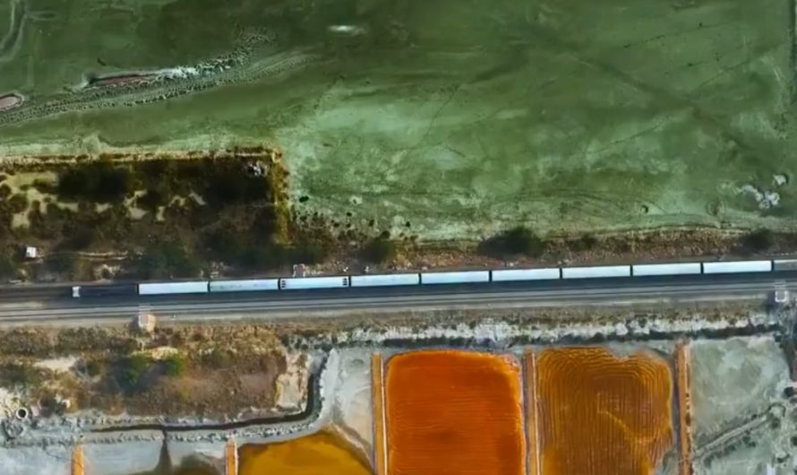 A Train passing through the salt extraction area of sambhar Lake in the Indian state of Rajasthan