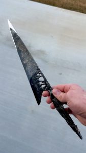 A blade forged from a 4.5 billion year old meteorite, the ‘Muonionalusta', one of the oldest meteorites ever recorded... It's crafted into a damascus steel, with both 24k gold and 14k gold with pearls inset into the handle