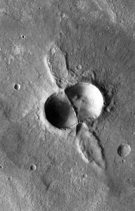 A dual crater from a meteorite that broke in two shortly before hitting the Martian surface.