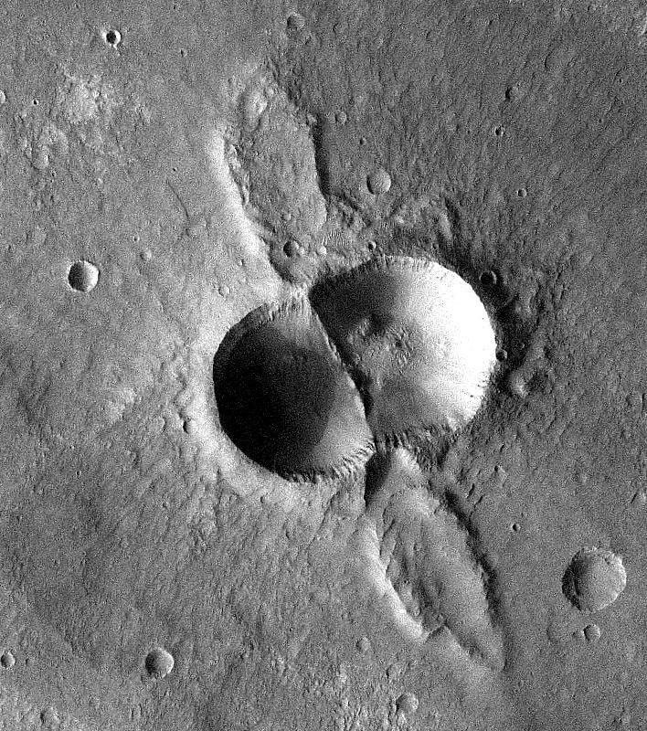 A dual crater from a meteorite that broke in two shortly before hitting the Martian surface.