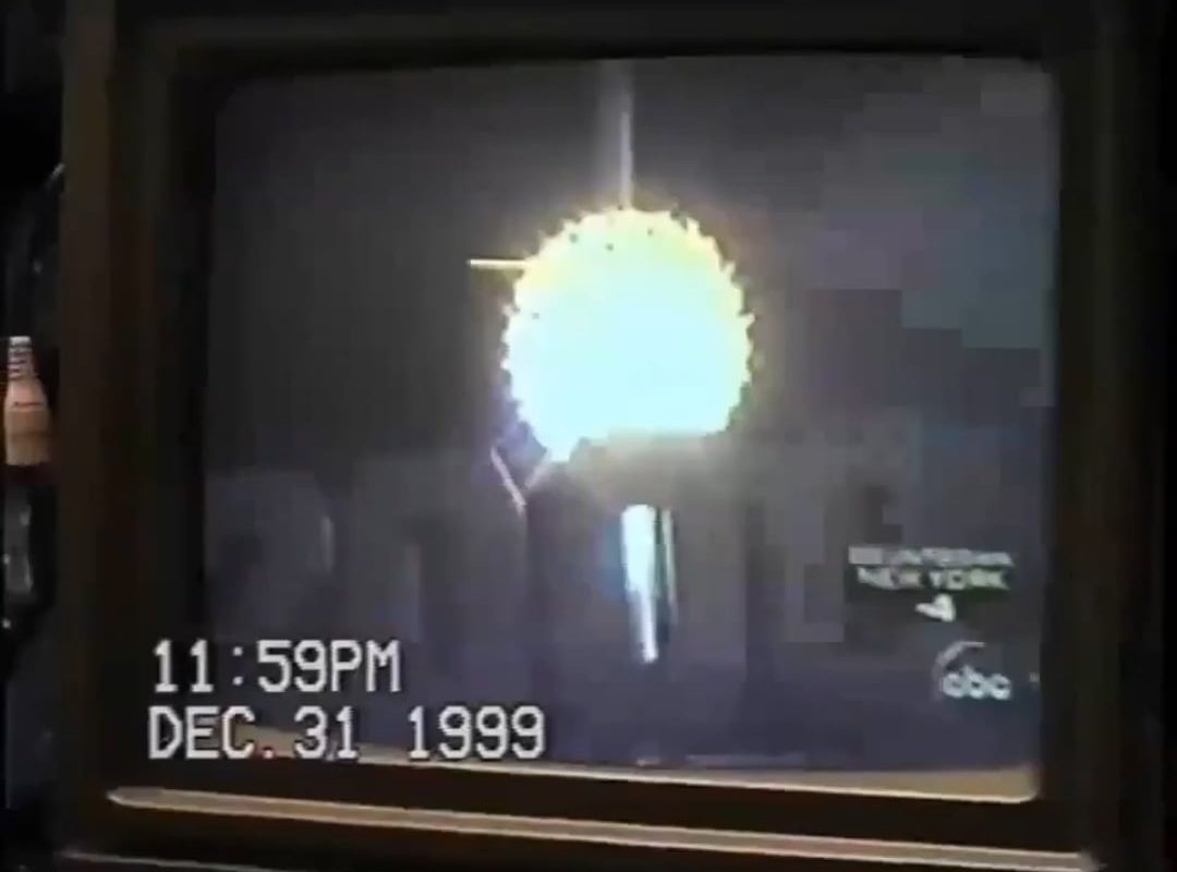 A guy checks his computer on New Year's night, 2000