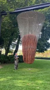A kinetic sound sphere composed of 850 metal parts, each suspended from a wire