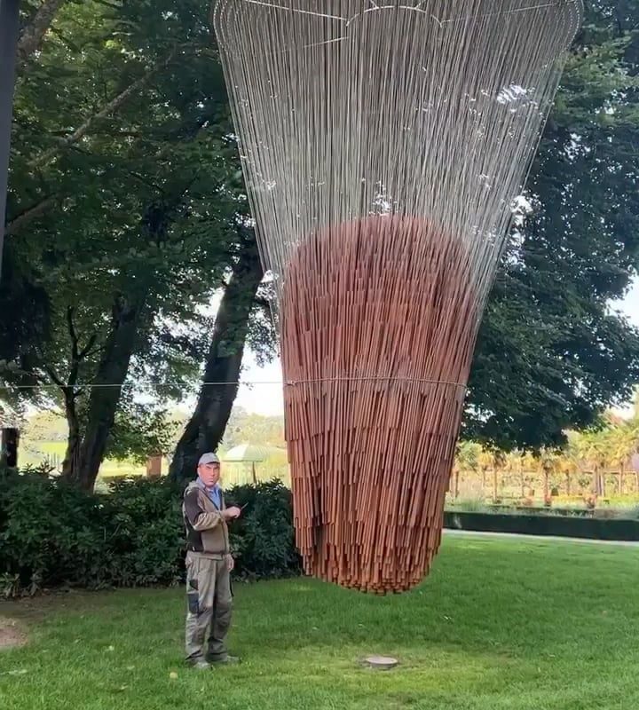 A kinetic sound sphere composed of 850 metal parts, each suspended from a wire